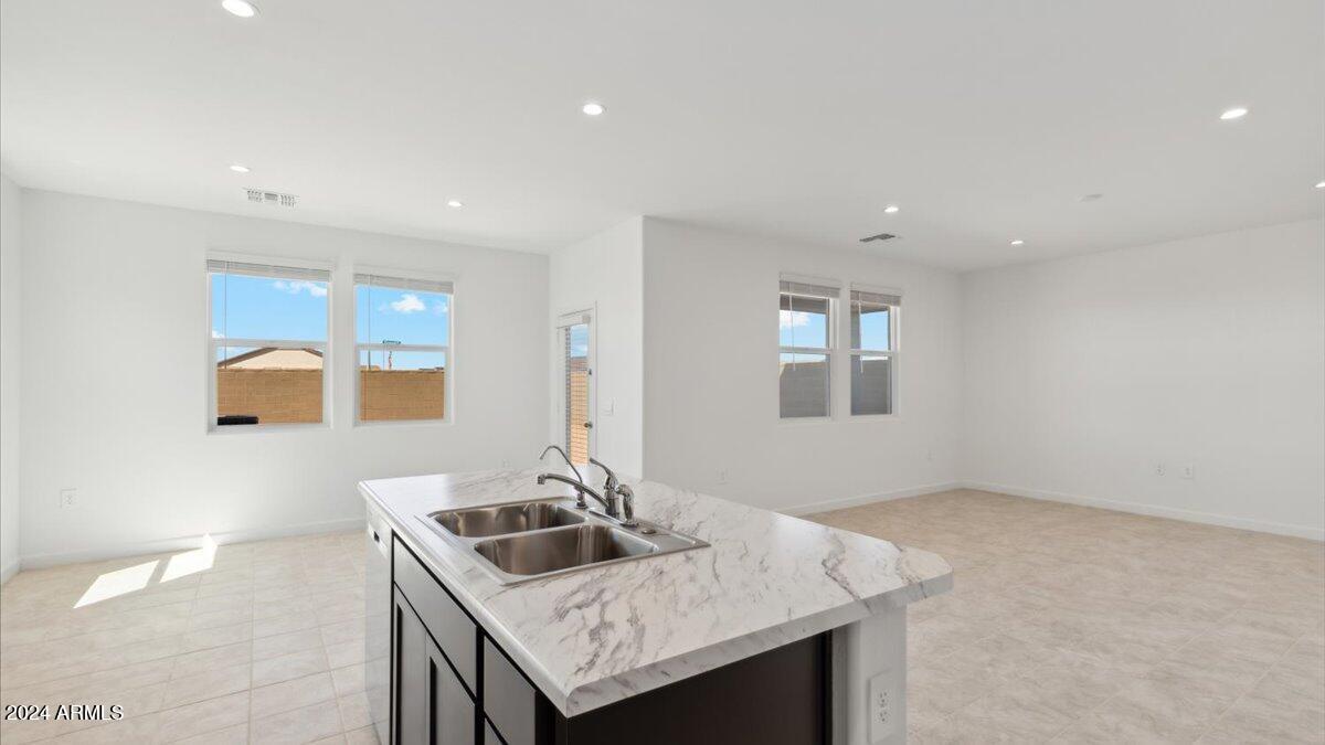 9202 South Palo Verde Drive Apache Junction, AZ 85120 - Photo 12 of 24 a kitchen with a sink cabinets and window