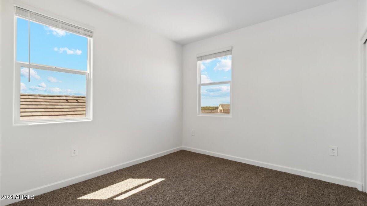 9202 South Palo Verde Drive Apache Junction, AZ 85120 - Photo 19 of 24 an empty room with windows