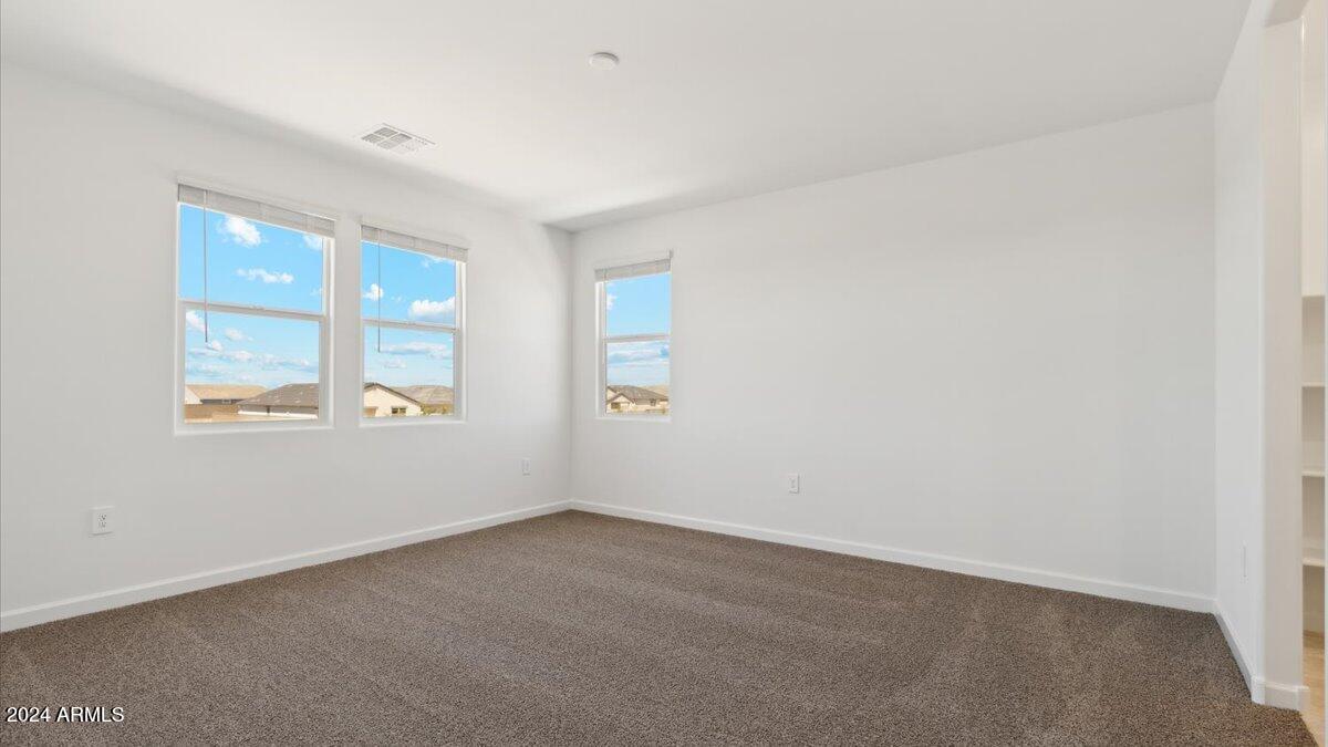 9202 South Palo Verde Drive Apache Junction, AZ 85120 - Photo 20 of 24 an empty room with windows