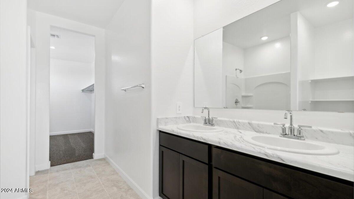 9202 South Palo Verde Drive Apache Junction, AZ 85120 - Photo 23 of 24 a bathroom with a double vanity sink and mirror