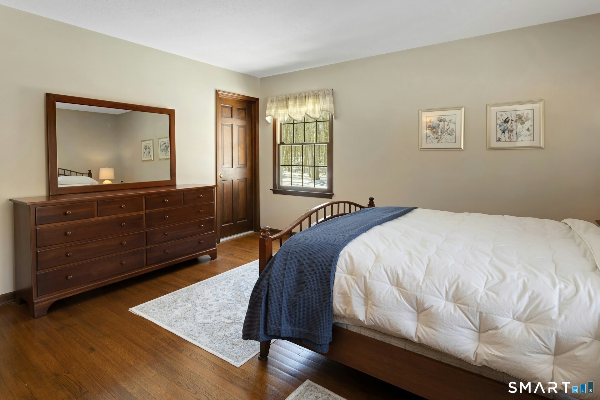 295 Judd Road Easton, CT 06612 - Photo 11 of 33 a bed sitting in a bedroom and dresser next to a window