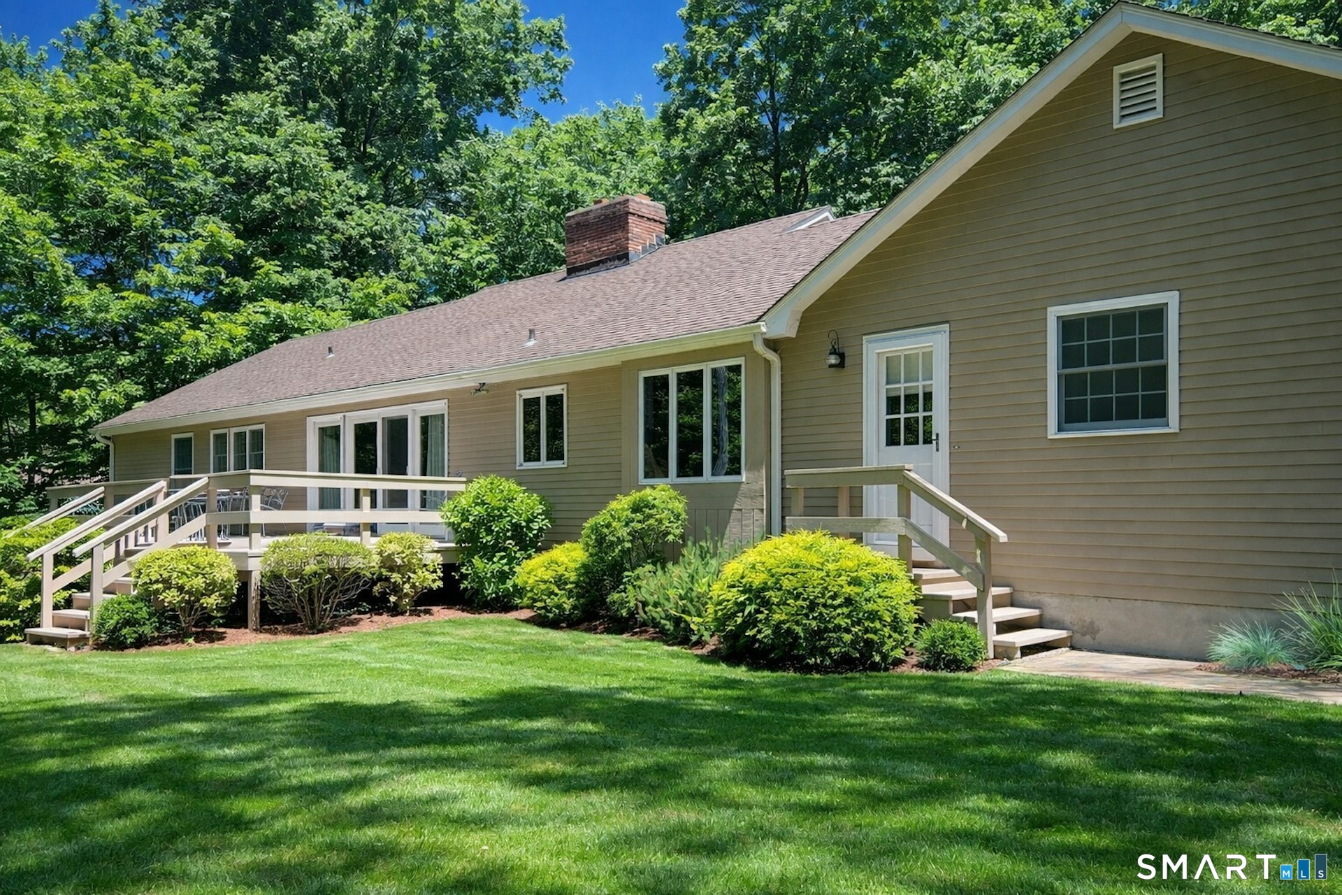 295 Judd Road Easton, CT 06612 - Photo 15 of 33 a view of a house with a yard and plants