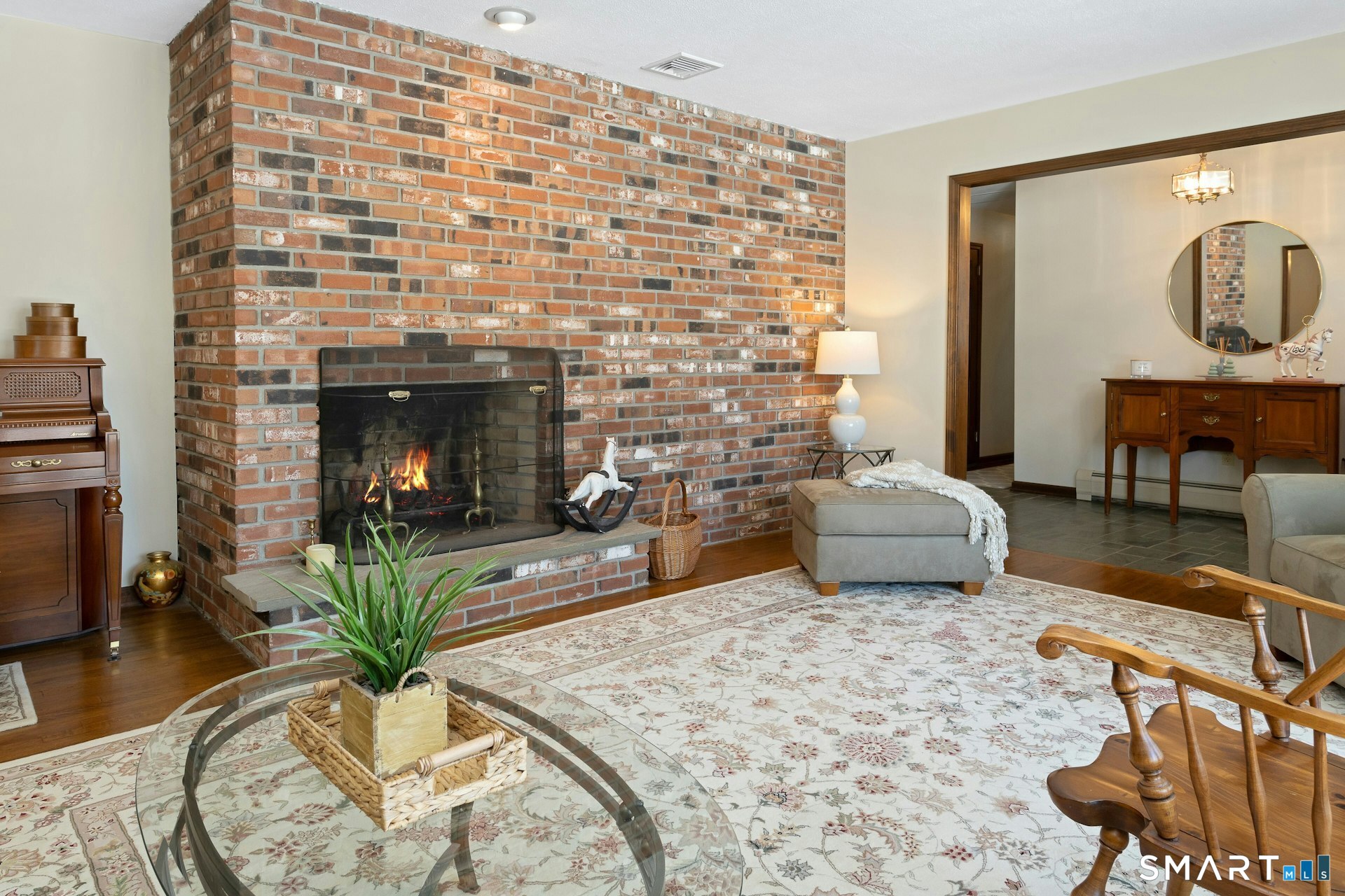 295 Judd Road Easton, CT 06612 - Photo 20 of 33 a living room with furniture and a fireplace