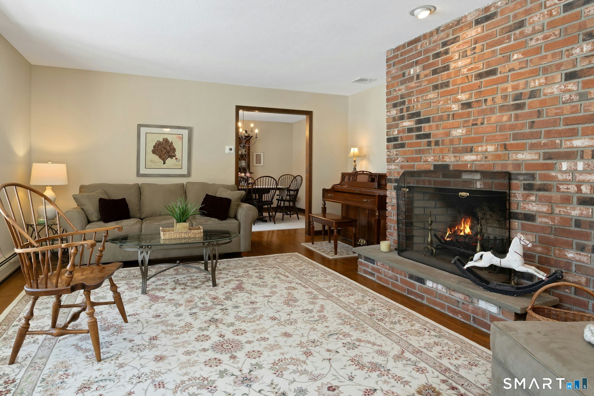295 Judd Road Easton, CT 06612 - Photo 21 of 33 a living room with furniture and a fireplace