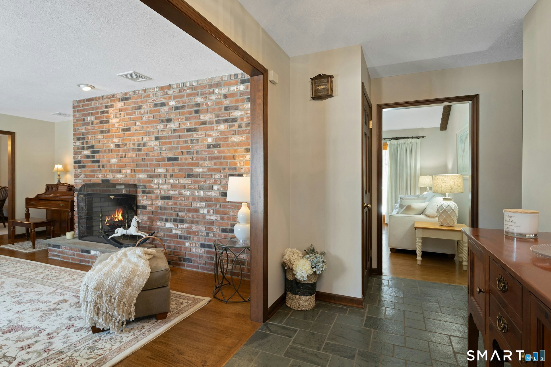295 Judd Road Easton, CT 06612 - Photo 23 of 33 a living room with furniture and a fireplace