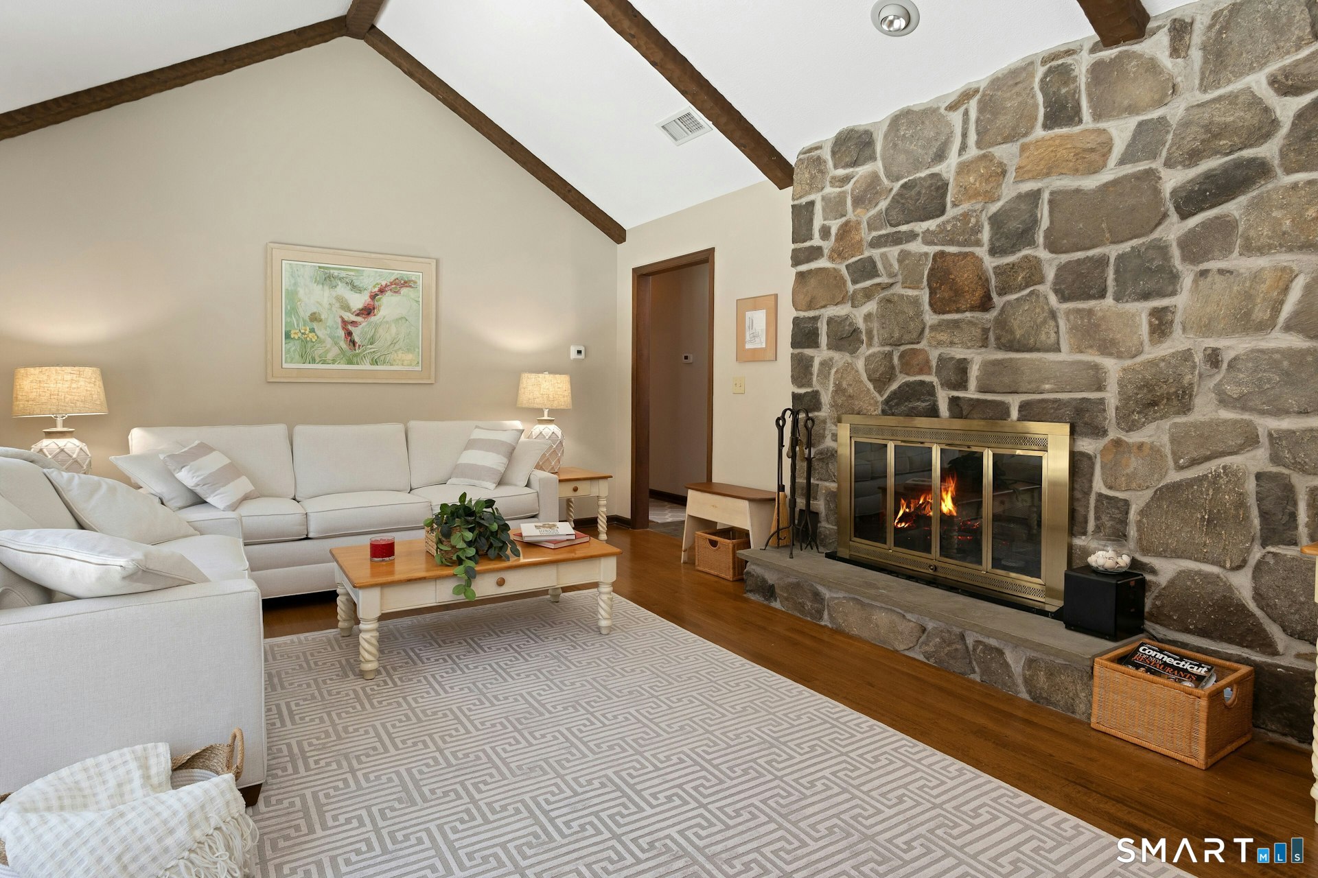 295 Judd Road Easton, CT 06612 - Photo 24 of 33 a living room with furniture and a rug