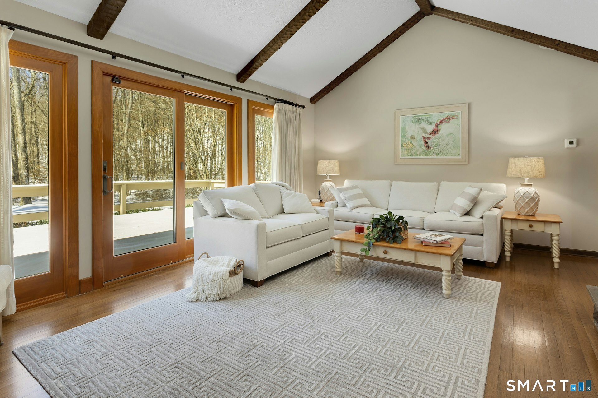 295 Judd Road Easton, CT 06612 - Photo 26 of 33 a living room with furniture and a large window