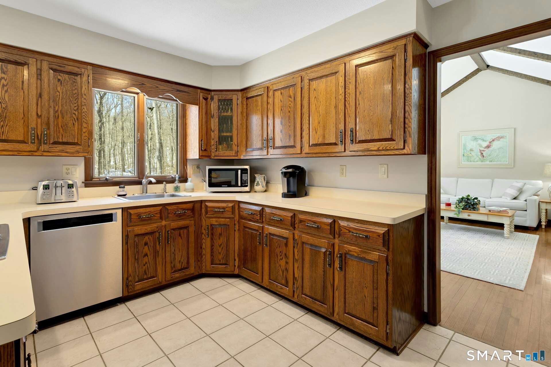 295 Judd Road Easton, CT 06612 - Photo 3 of 33 a kitchen with stainless steel appliances a sink window and cabinets