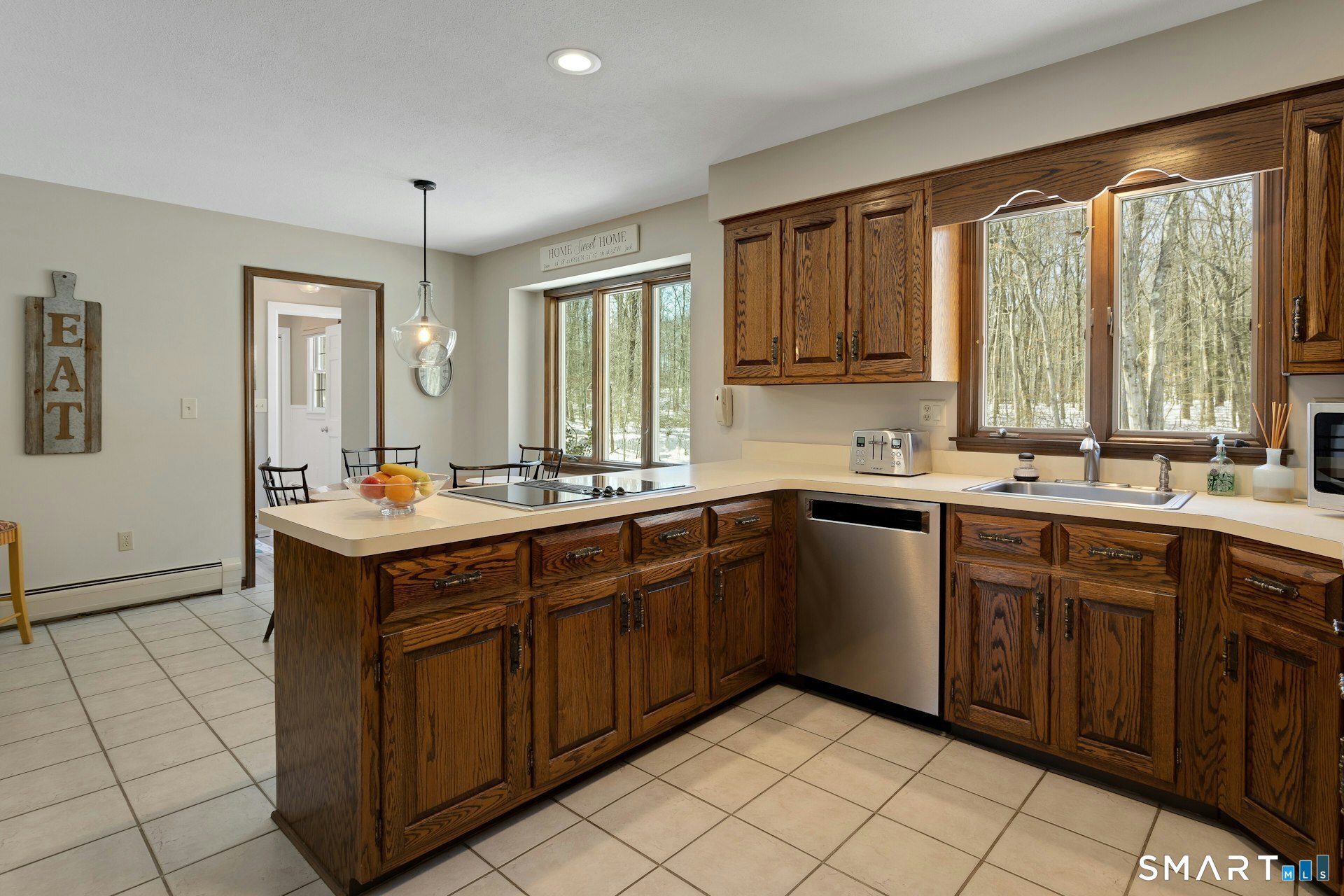 295 Judd Road Easton, CT 06612 - Photo 4 of 33 a kitchen with a sink window and cabinets