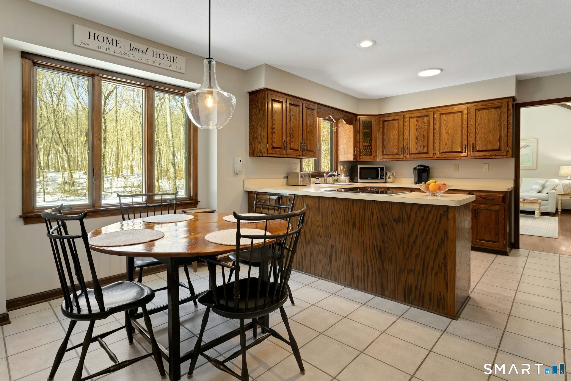 295 Judd Road Easton, CT 06612 - Photo 6 of 33 a kitchen with a stove a sink a refrigerator and a dining table