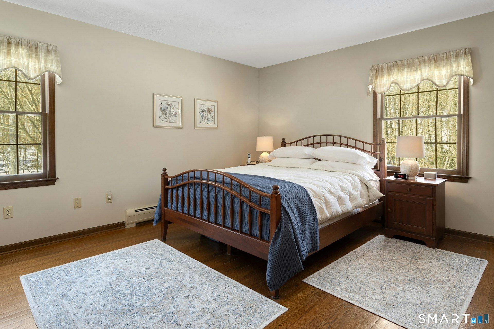 295 Judd Road Easton, CT 06612 - Photo 9 of 33 a bed sitting in a bedroom next to a window