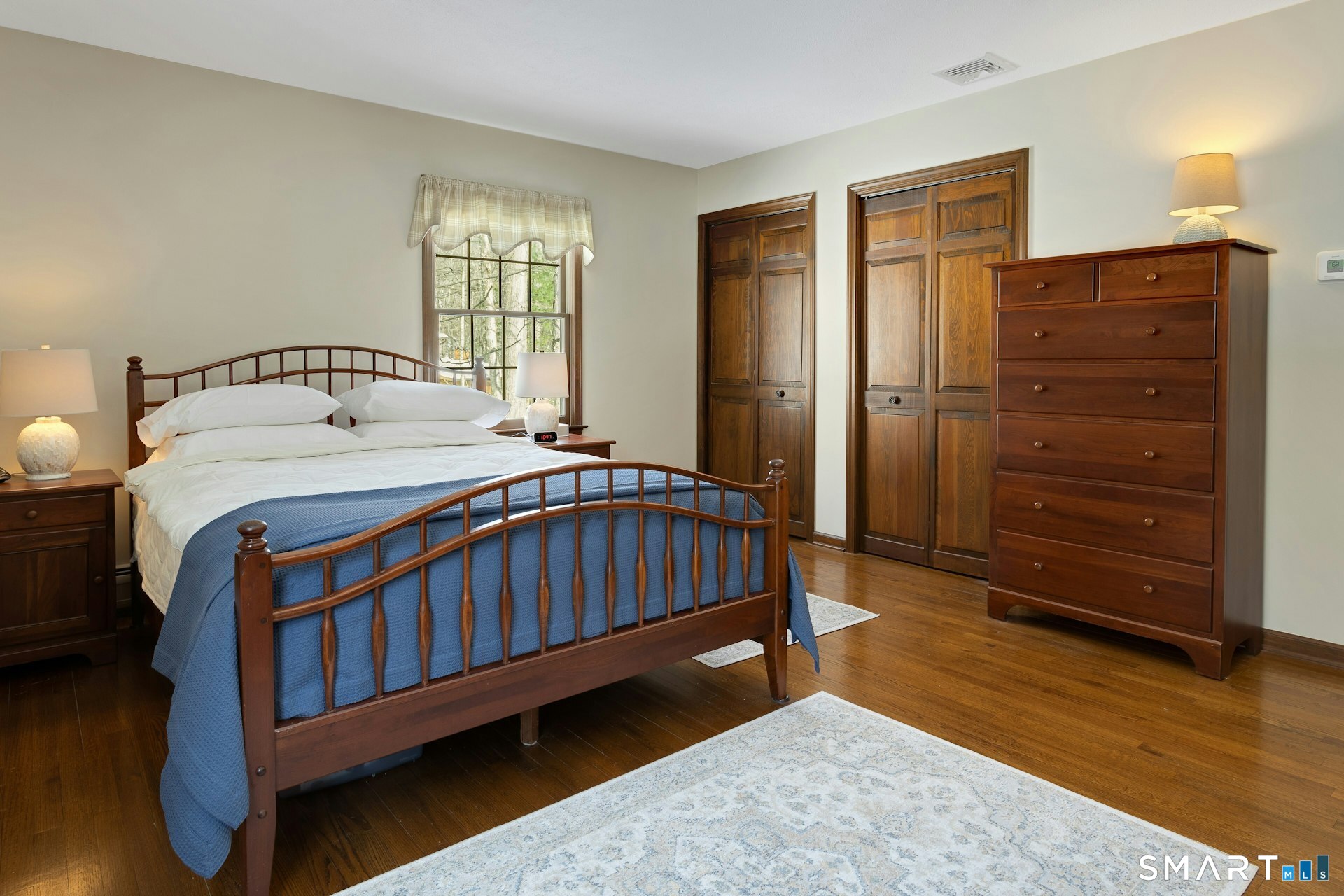 295 Judd Road Easton, CT 06612 - Photo 10 of 33 a bedroom with a bed window and a dresser