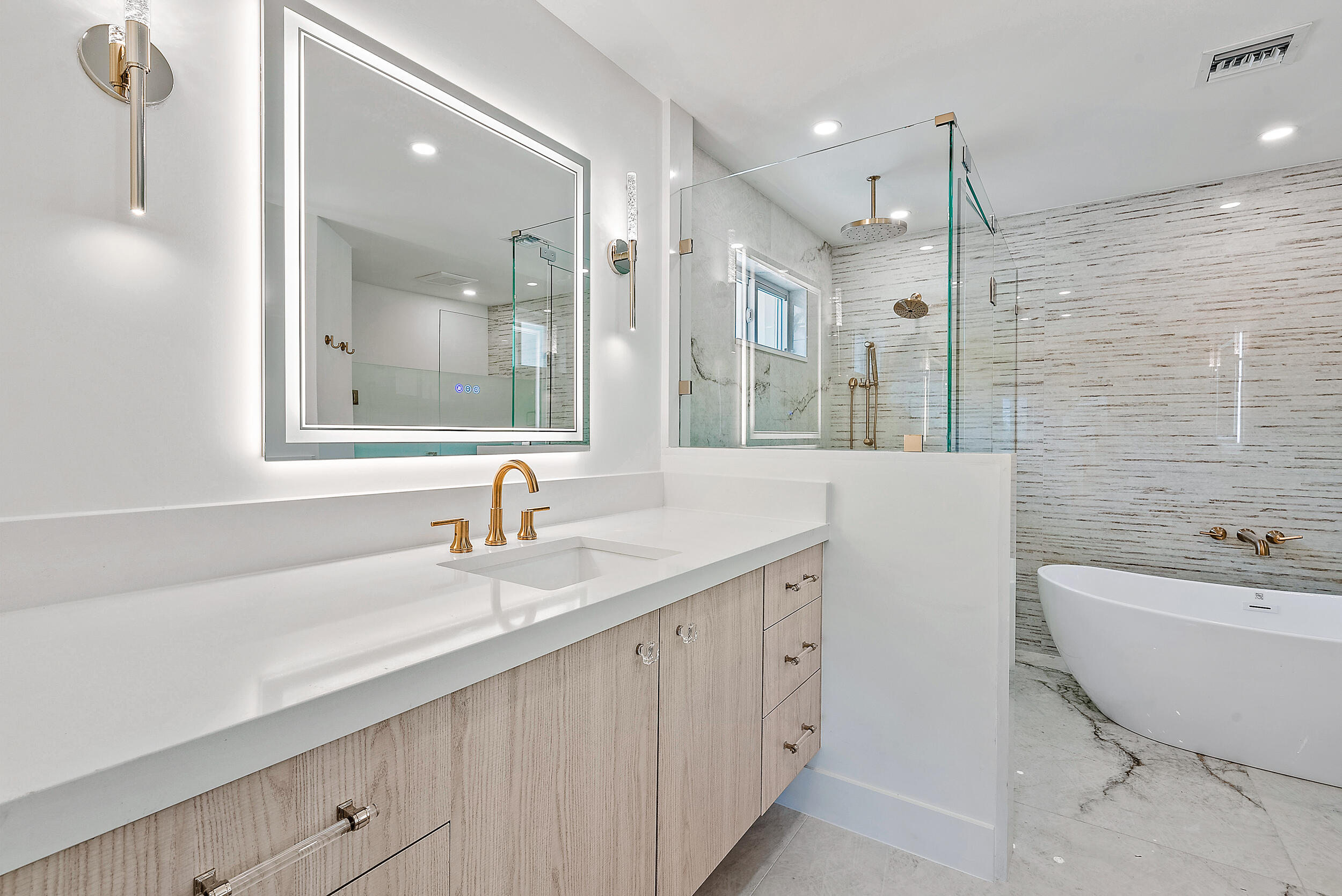310 Edmor Road West Palm Beach, FL 33405 - Photo 19 of 32 a bathroom with a double vanity sink mirror and bathtub