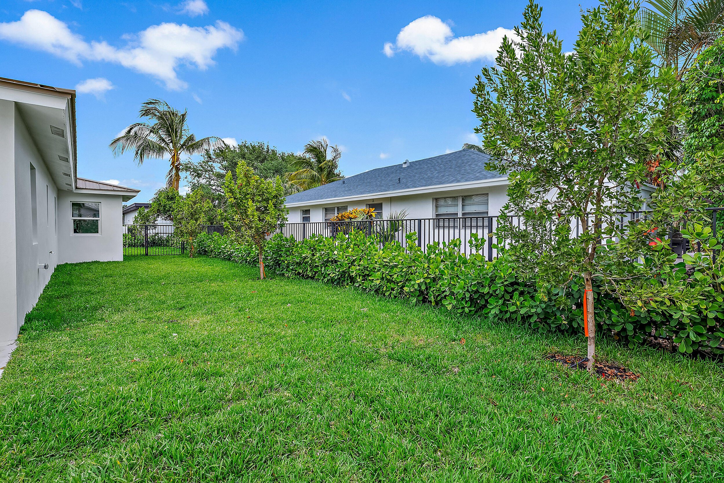 310 Edmor Road West Palm Beach, FL 33405 - Photo 32 of 32 a view of a house with a backyard