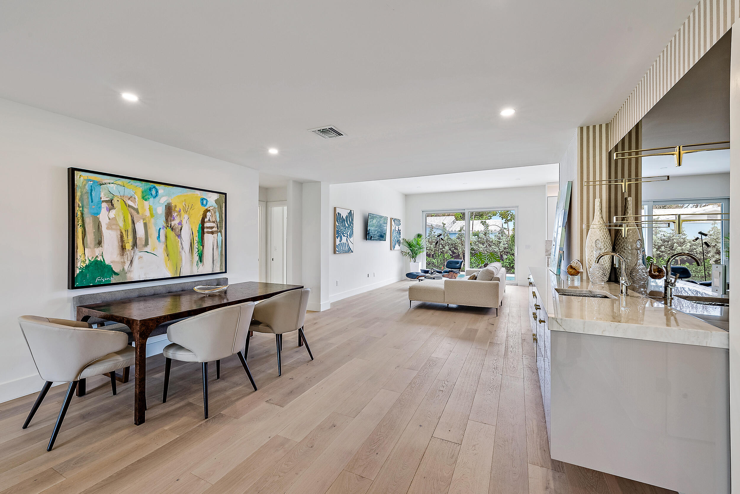 310 Edmor Road West Palm Beach, FL 33405 - Photo 6 of 32 a view of a dining room with furniture window and wooden floor