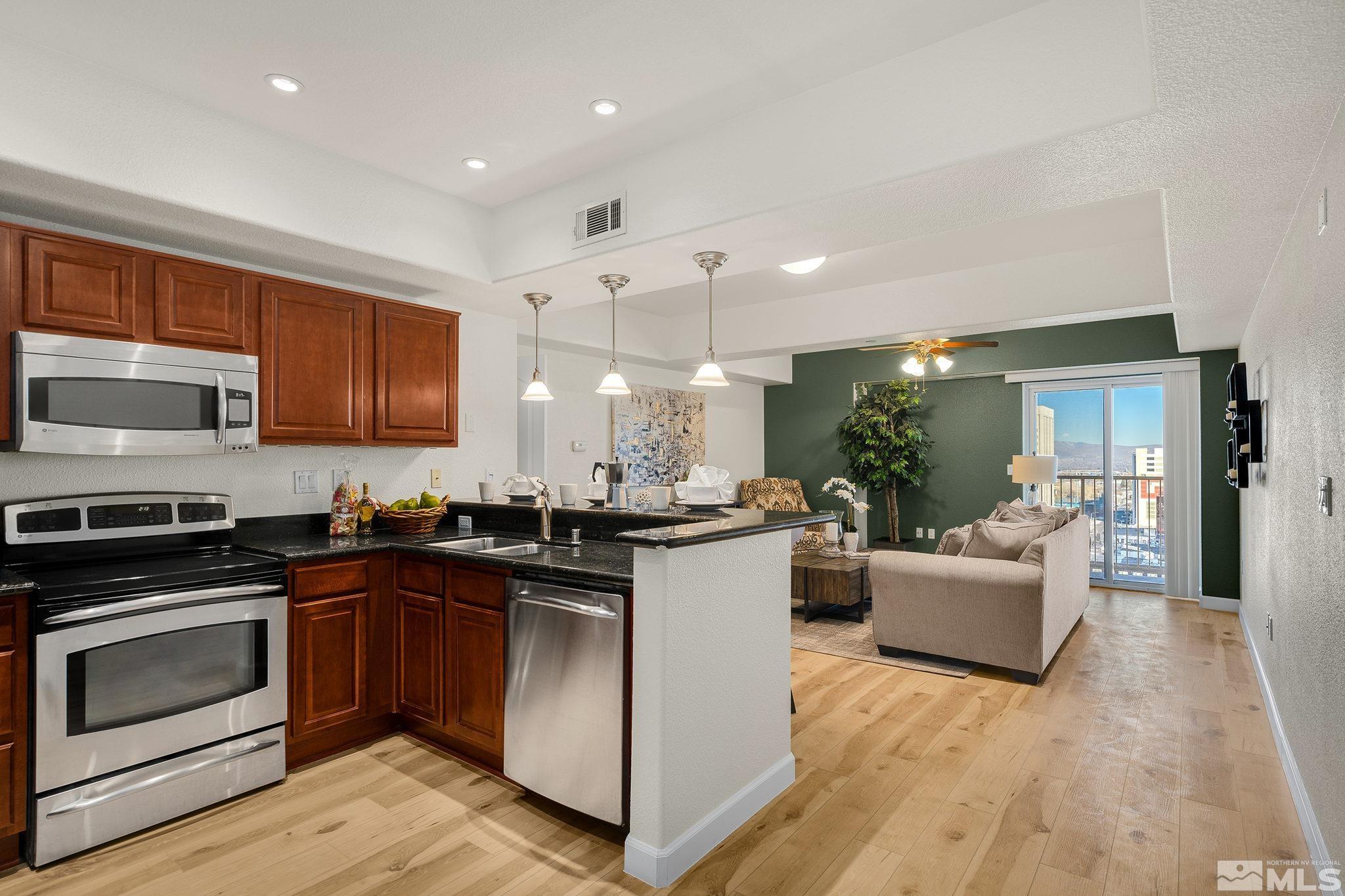 200 West 2nd Street, Unit 1503 Reno, NV 89501 - Photo 2 of 28 a kitchen with counter top space and appliances