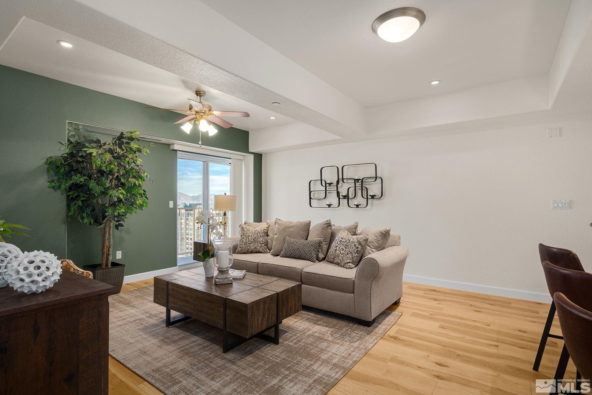 200 West 2nd Street, Unit 1503 Reno, NV 89501 - Photo 3 of 28 a living room with furniture and a potted plant