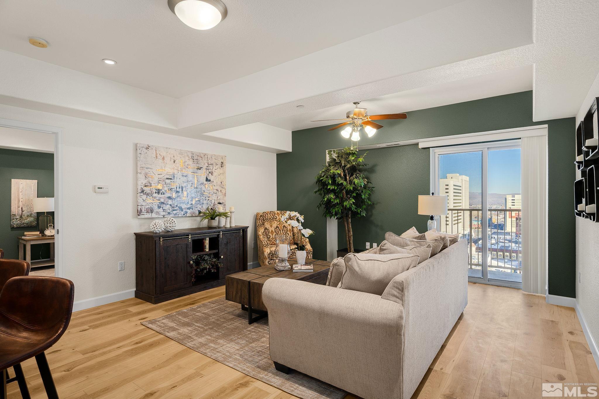 200 West 2nd Street, Unit 1503 Reno, NV 89501 - Photo 4 of 28 a living room with furniture and a potted plant