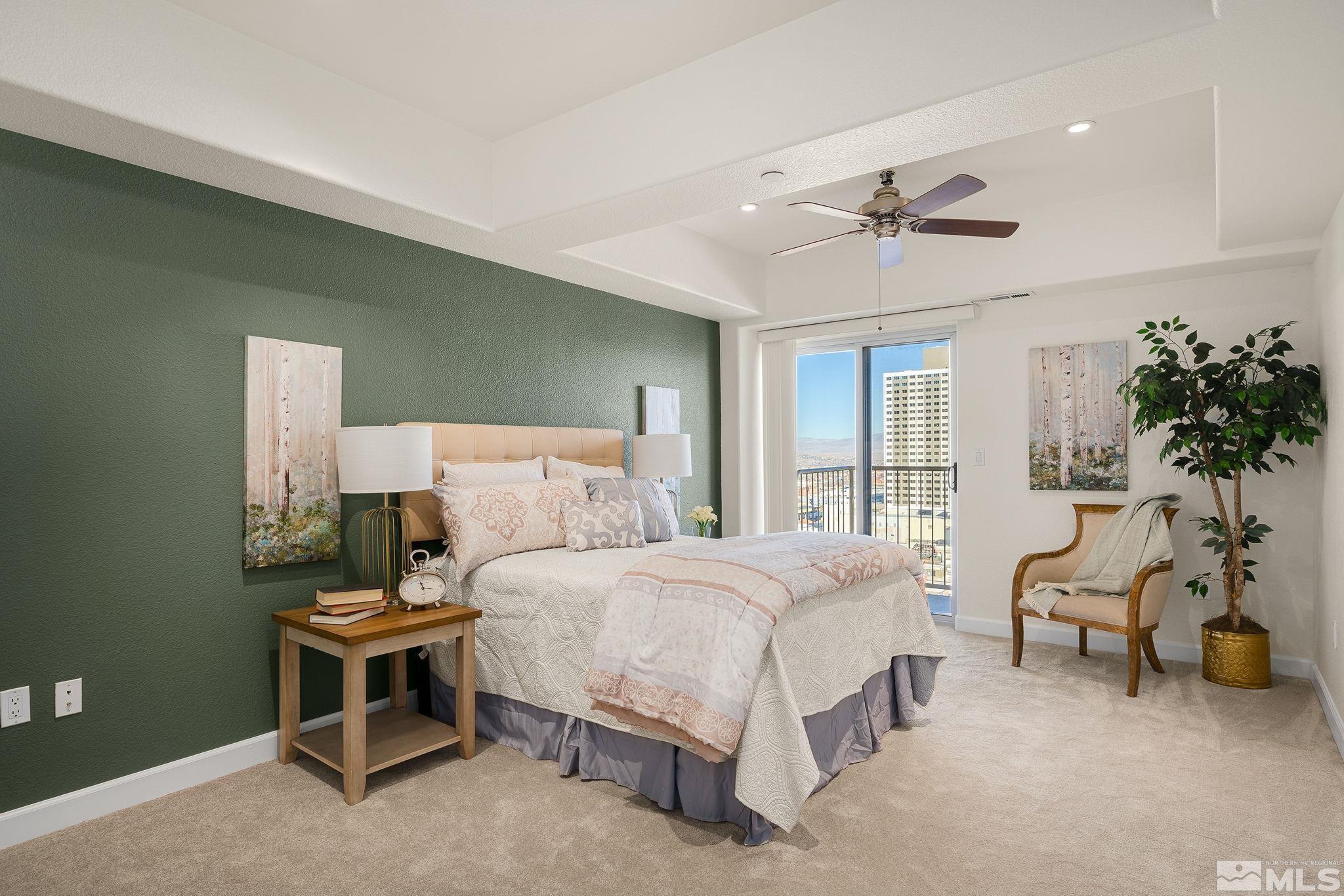 200 West 2nd Street, Unit 1503 Reno, NV 89501 - Photo 9 of 28 a bedroom with a bed furniture potted plant and a window