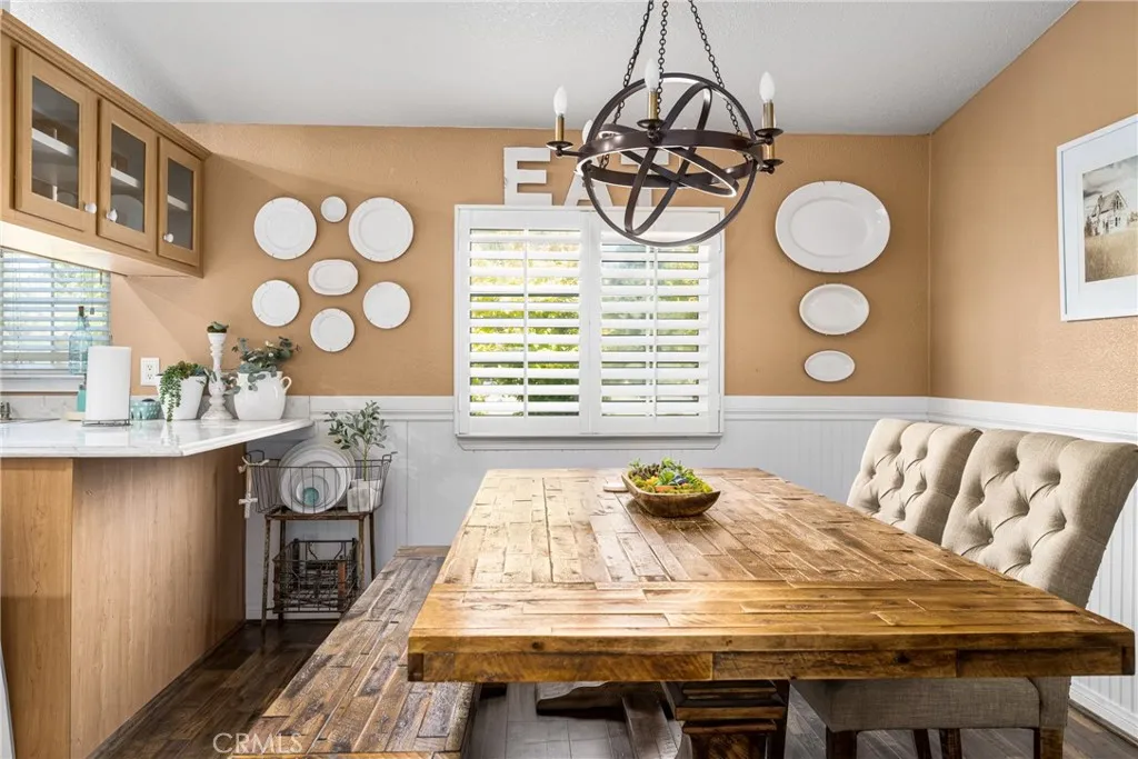 1051 Site, Unit 91 Brea, CA 92821 - Photo 12 of 32 a view of a dining room with furniture and wooden floor