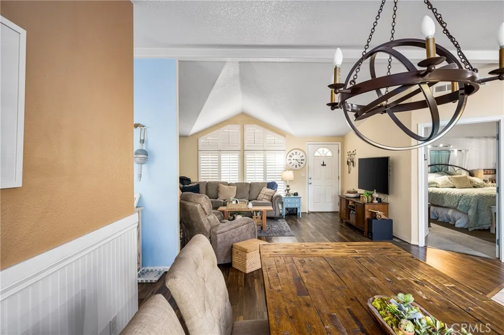 1051 Site, Unit 91 Brea, CA 92821 - Photo 16 of 32 a living room with furniture a fireplace and gym equipment