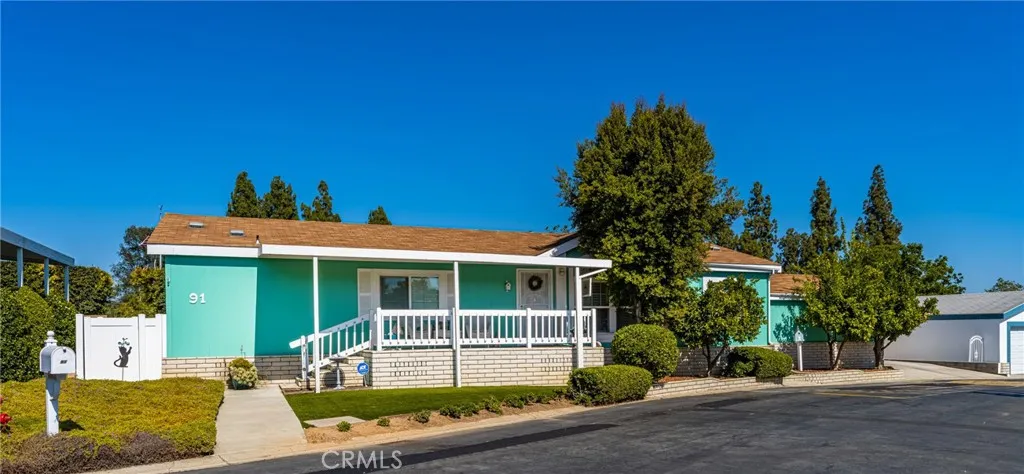 1051 Site, Unit 91 Brea, CA 92821 - Photo 2 of 32 a front view of a house with garden
