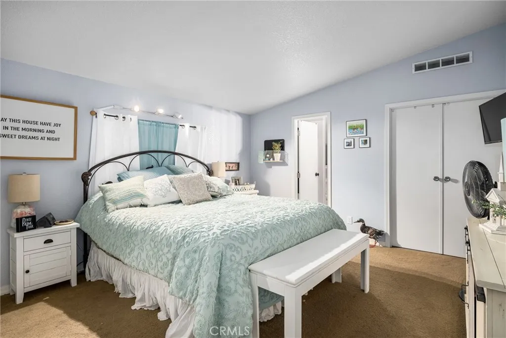 1051 Site, Unit 91 Brea, CA 92821 - Photo 25 of 32 a bedroom with a bed and a dresser