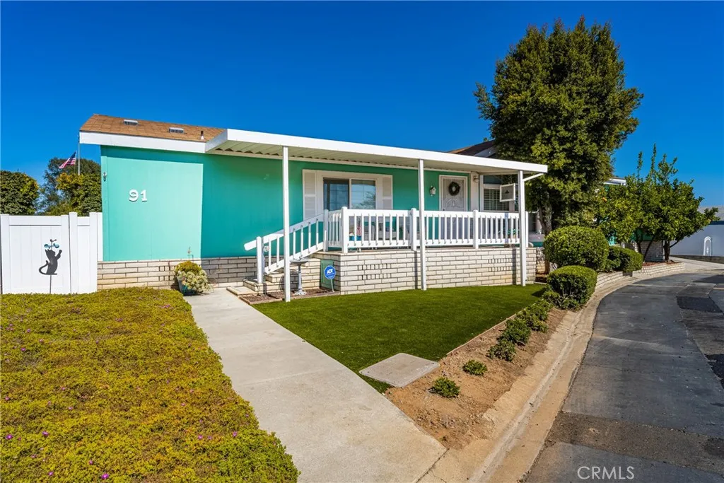 1051 Site, Unit 91 Brea, CA 92821 - Photo 3 of 32 a front view of a house with garden
