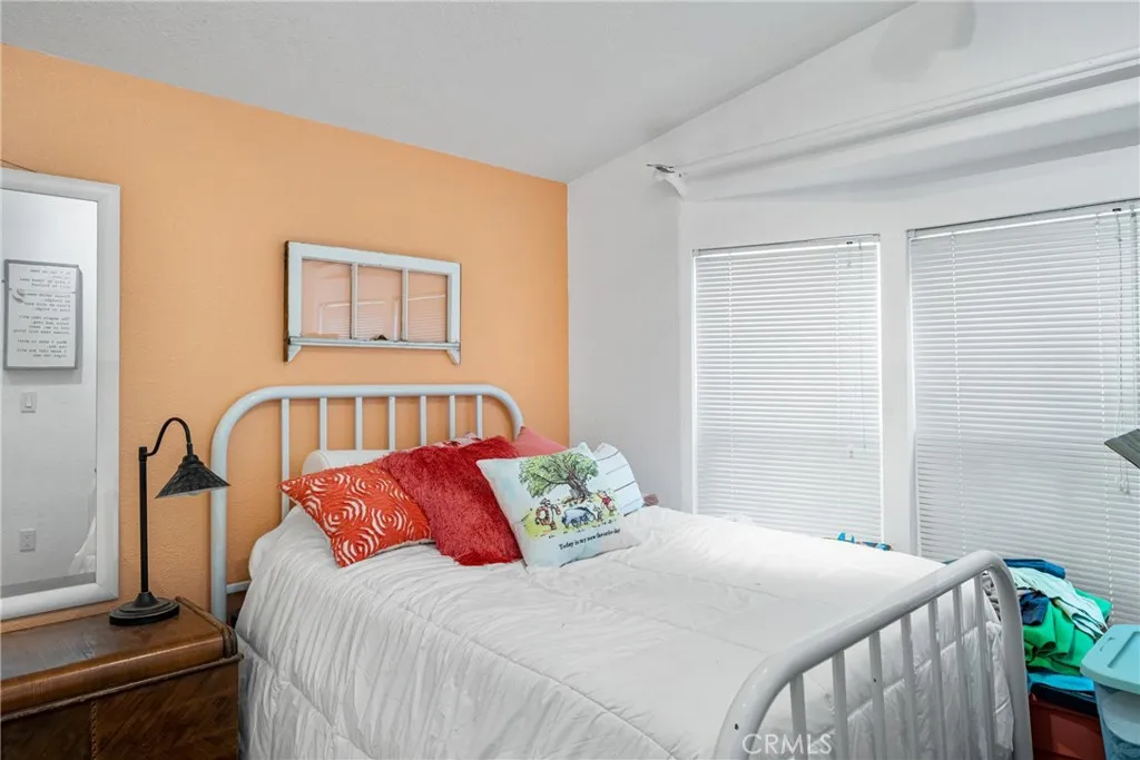 1051 Site, Unit 91 Brea, CA 92821 - Photo 32 of 32 a bedroom with a bed and a large mirror