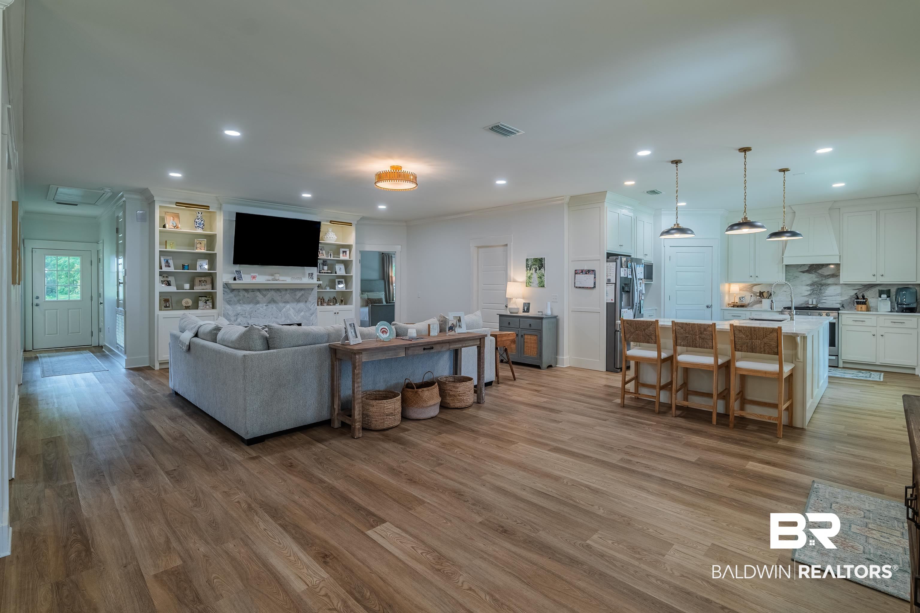 19121 Boothe Road Fairhope, AL 36532 - Photo 15 of 41 Living area with ornamental molding, light wood-style flooring, recessed lighting, and built in features