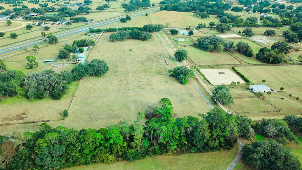 4600 Miller Road Ocala, FL 34482 - Photo 11 of 13 an aerial view of residential house with outdoor space and trees all around