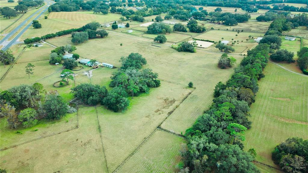 4600 Miller Road Ocala, FL 34482 - Photo 10 of 13 an aerial view of residential house with outdoor space and trees all around