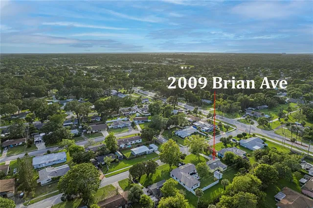 an aerial view of residential building and parking space
