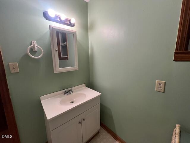 3339 Ebenezer Church Road Benson, NC 27504 - Photo 17 of 27 a bathroom with a sink and a mirror
