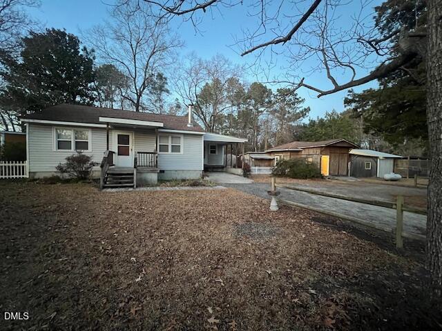3339 Ebenezer Church Road Benson, NC 27504 - Photo 3 of 27 a view of a house with a backyard