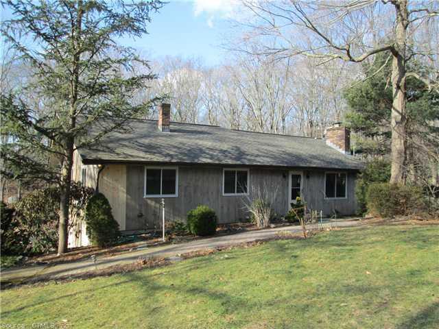 27 A River Road Clinton, CT 06413 - Photo 1 of 1 a backyard of a house with yard table and chairs