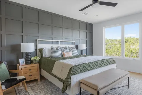 a kitchen with stainless steel appliances granite countertop a sink a refrigerator and a stove