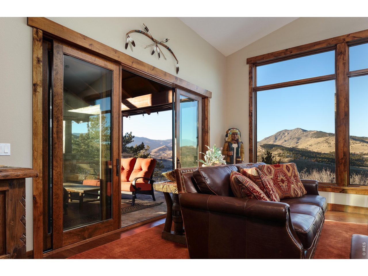 515 Indian Mountain Road Lyons, CO 80540 - Photo 19 of 40 a living room with furniture and a window