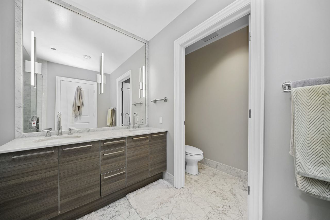 10 East Delaware Place, Unit 18E Chicago, IL 60611 - Photo 23 of 56 a bathroom with a sink toilet and shower