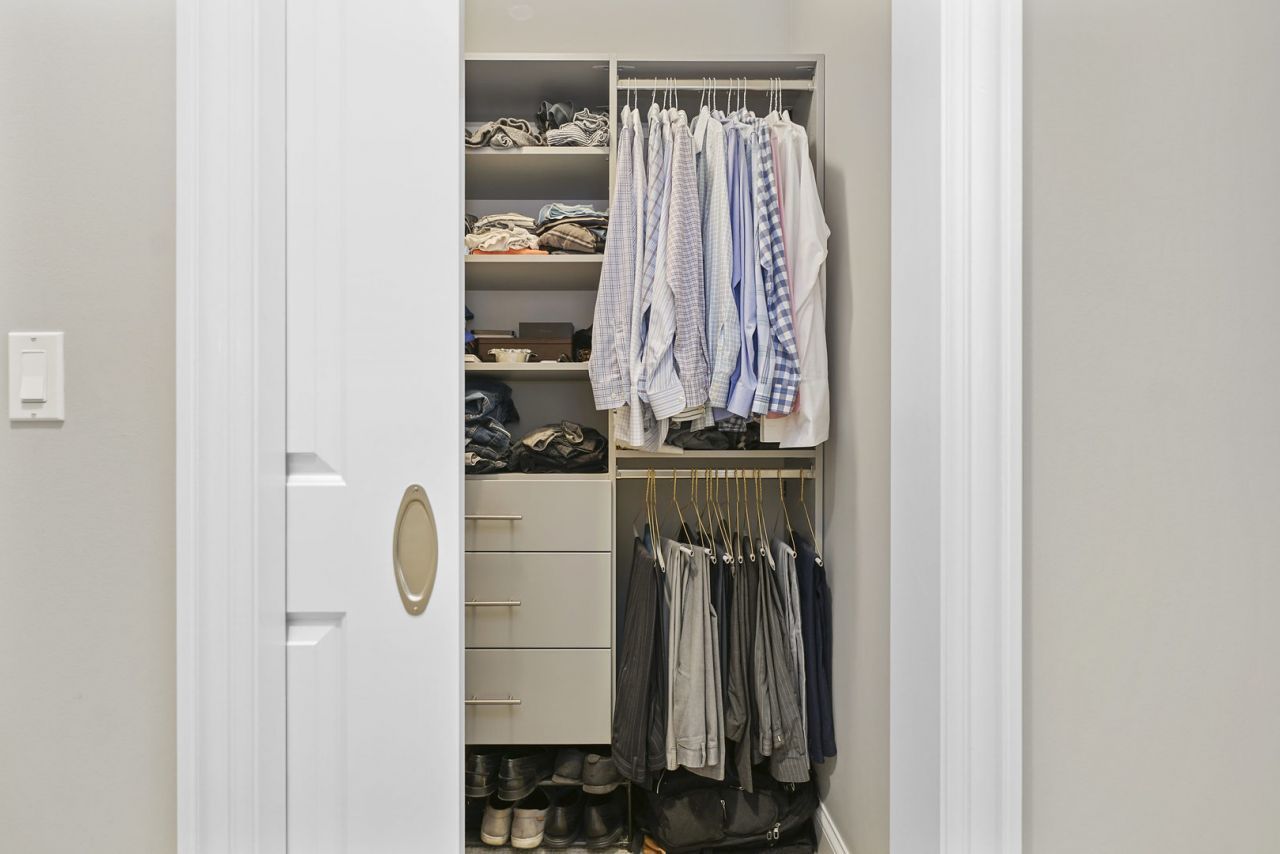 10 East Delaware Place, Unit 18E Chicago, IL 60611 - Photo 26 of 56 a view of walk in closet with clothes and shoes