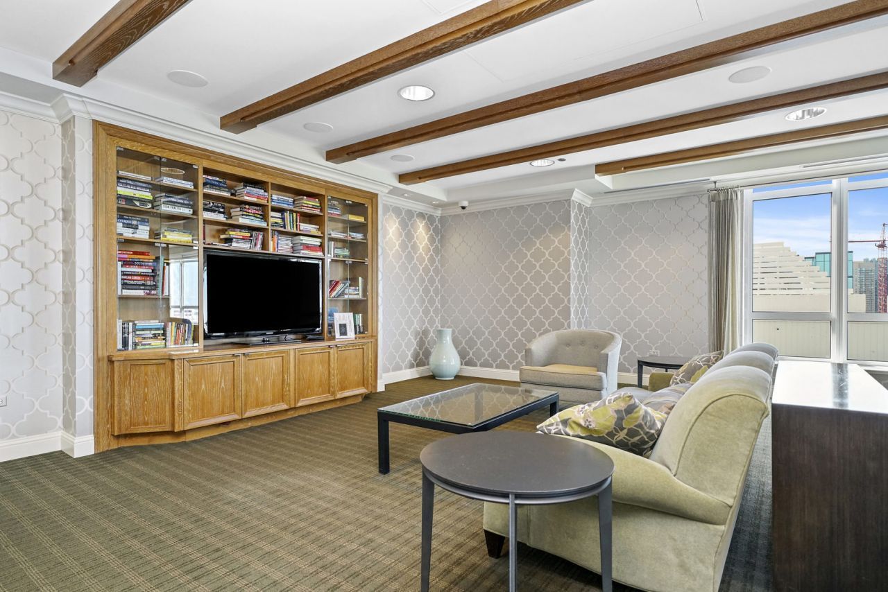 10 East Delaware Place, Unit 18E Chicago, IL 60611 - Photo 48 of 56 a living room with furniture and a flat screen tv