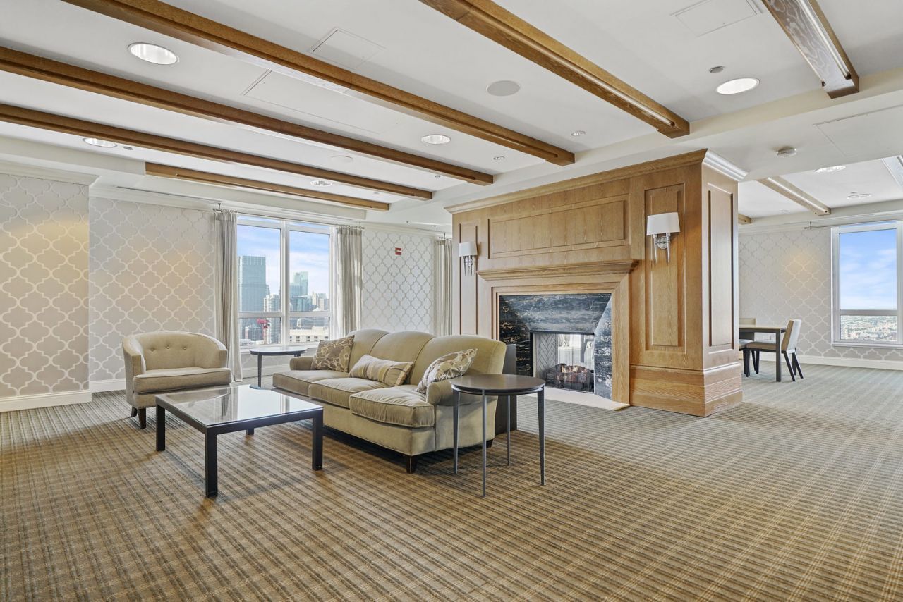 10 East Delaware Place, Unit 18E Chicago, IL 60611 - Photo 49 of 56 a living room with furniture and a fireplace