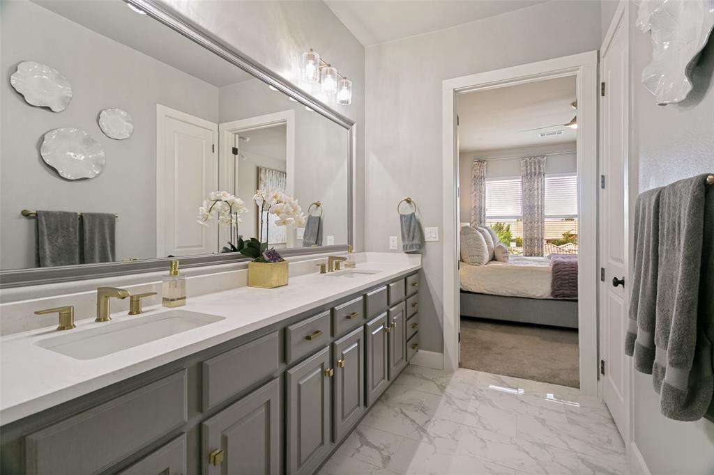 610 Via Ravello, Unit 406 Irving, TX 75039 - Photo 18 of 25 Primary Bathroom includes an oversized walk-in closet with a custom system.