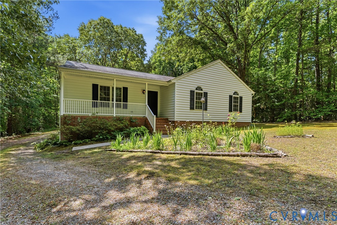 12654 Mt Olive Cohoke Road West Point, VA 23181 - Photo 2 of 31 a front view of a house with a yard