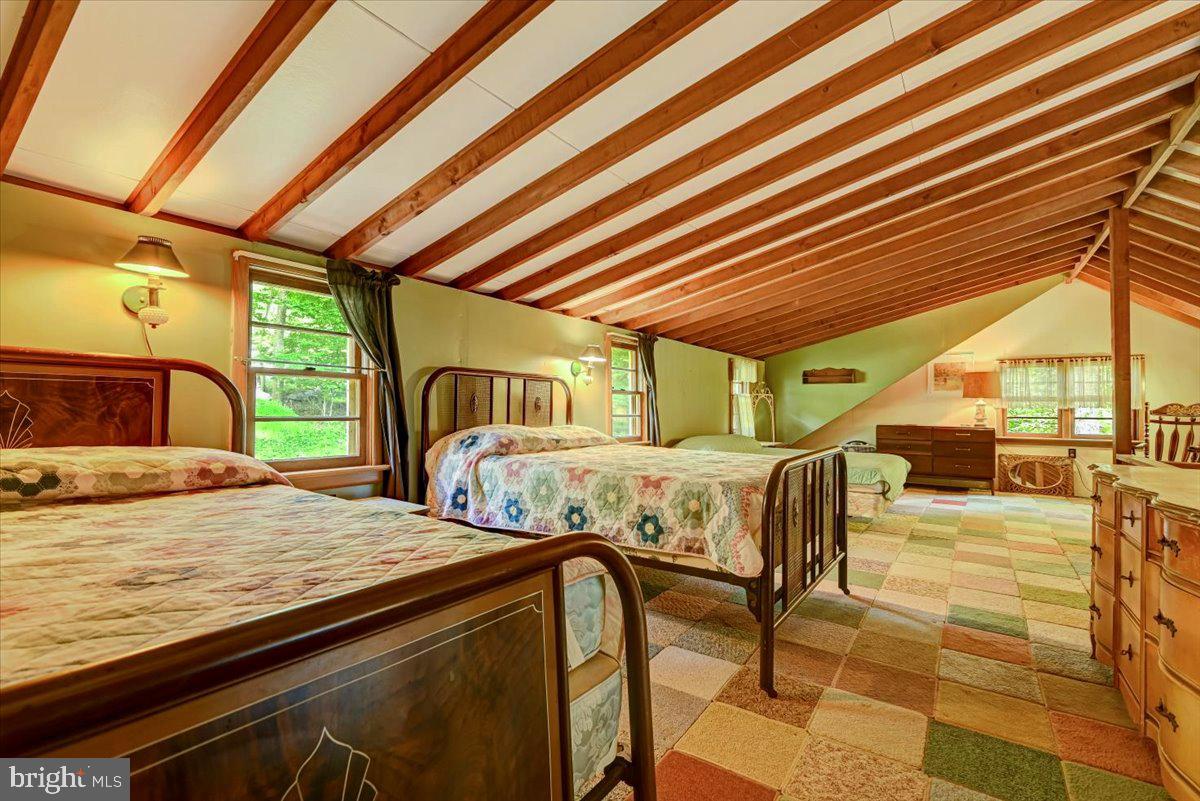 112 Beechwood Cove Road Greentown, PA 18426 - Photo 28 of 59 a bedroom with furniture and a window