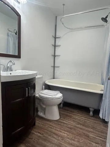 a bathroom with a toilet a sink and bathtub