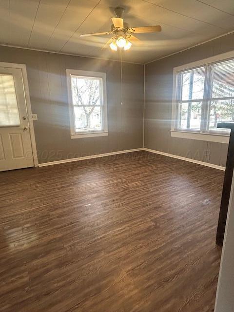 810 South Sweetwater Street Wheeler, TX 79096 - Photo 4 of 14 wooden floor in an empty room with a window