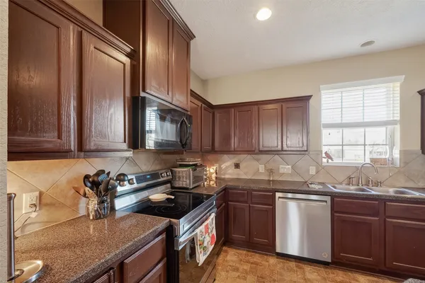 a bedroom with furniture and a flat screen tv