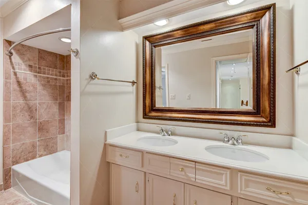 a living room with furniture and chandelier