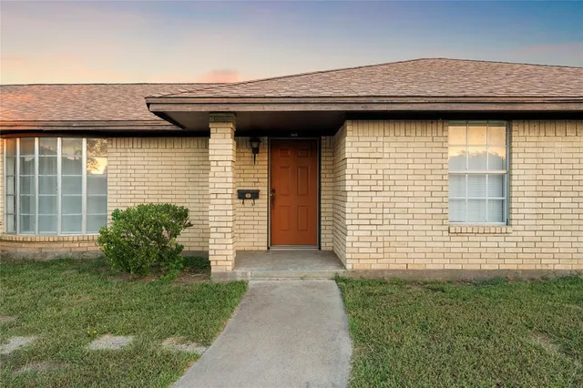 a house view with a backyard space
